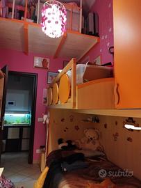 Cameretta due letti con scalette laterali 