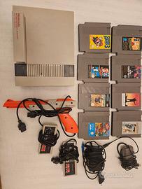 Nintendo Nes anni 90 con cavi, controller e giochi