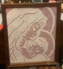 Quadro raffigurante la Madonna col Bambino.Realizz