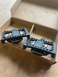 Pedali SHIMANO attacco SPD con adattatore flat
