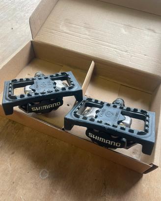 Pedali SHIMANO attacco SPD con adattatore flat