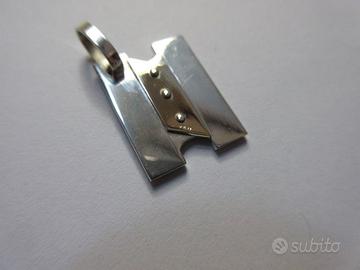 Iniziale N in argento e oro