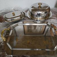 servizio da tavola in acciaio e incisioni oro