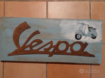 scritta vespa vintage in acciaio