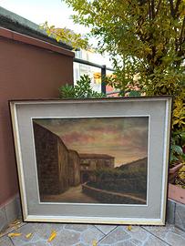 Strada di paese con case di sasso al tramonto