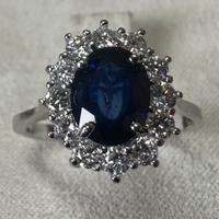 ANELLO ORO 18kt. CON DIAMANTI E ZAFFIRO BLU OVALE