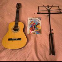 Chitarra, leggio e libro di studio per ragazzi del