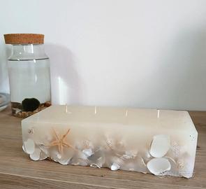 Candela con conchiglie