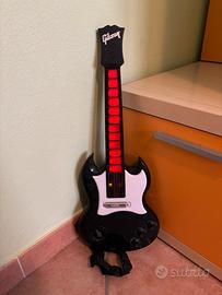 Chitarra giocattolo “Gibson” diavoletto com musica