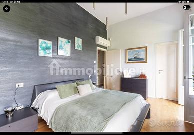 Letto molteni pelle nera completo di comodini