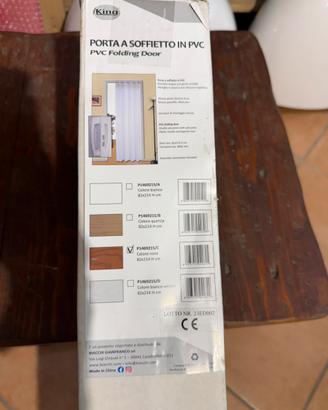 Porta a soffietto in PVC con profili rovere