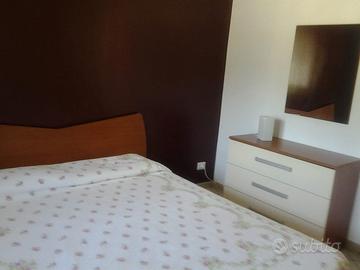 Bilocale in resort con piscina