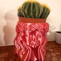 Vaso con faccia di bambina