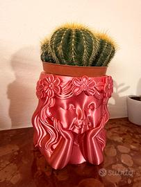 Vaso con faccia di bambina