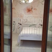 Letto in ferro battuto e materasso