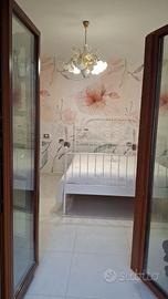 Letto in ferro battuto e materasso