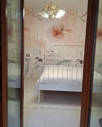 Letto in ferro battuto e materasso
