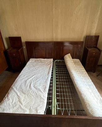 Letti singoli con rete e comodini