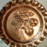 Piatto in rame decorativo