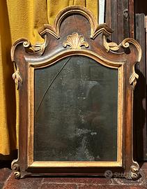 Specchiera in legno intagliato e dorato