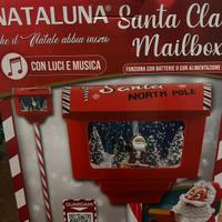 lampione di babbo natale con neve e musiche 