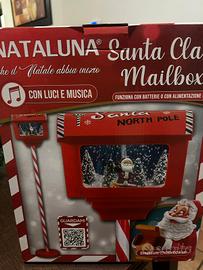 lampione di babbo natale con neve e musiche 