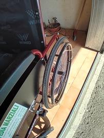 Carrozzina basculante polifunzionale