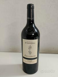 Due bottiglie di vino: Amarone e Nebbiolo.