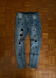 Jeans slim fit strappati azzurri taglia 36