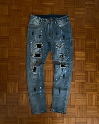 Jeans slim fit strappati azzurri taglia 36