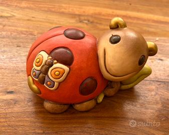 Thun coccinella con farfalla