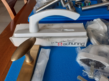 Maniglie Colombo-Schuring acciaio/bianco. Porlezza