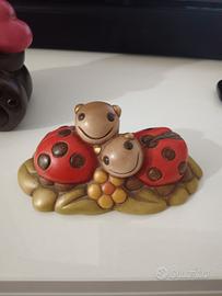 coppia coccinella con fiore thun