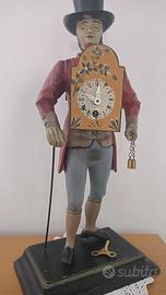 Antico orologio figurativo in metallo - Venditore