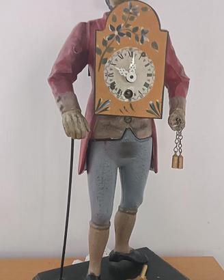 Antico orologio figurativo in metallo - Venditore