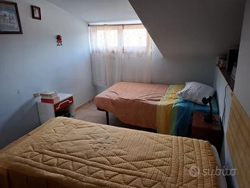 Mansarda con garage e spazio condominiale