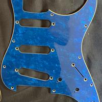 Stratocaster Pickguard’s Blue and Red Pearloid.