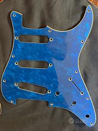 Stratocaster Pickguard’s Blue and Red Pearloid.