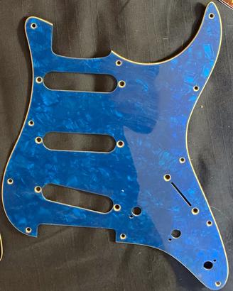 Stratocaster Pickguard’s Blue and Red Pearloid.