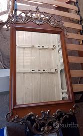 Specchio contornato da ottone