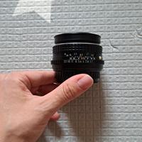 Obiettivo Pentax analogico 50 mm con anello adatta