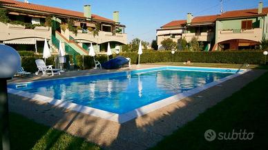 Appartamento piscina,posto auto, Wi-Fi clima