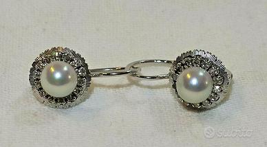 Paio orecchini d'epoca in oro bianco 750 con diama