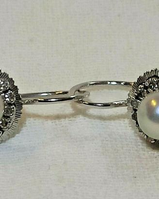 Paio orecchini d'epoca in oro bianco 750 con diama