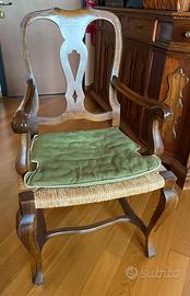 Poltrona in legno con braccioli