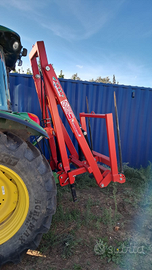 Caricatore posteriore per rotoballe