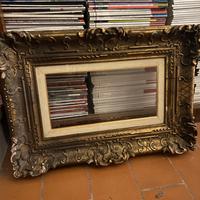 Vecchia cornice in legno intagliato