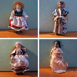 Quattro bambole da collezione in ceramica vintage