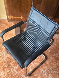 Poltrona nera pelle a slitta arredamento casa