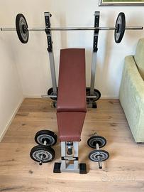 Panca + bilanciere + manubri Technogym